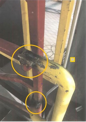 Figure 12: Photograph of Handrail with the Welded Areas Circled in Yellow.