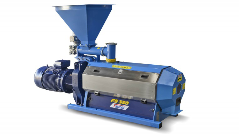 Figure 7: Extrusion screw press with hot plate used to produce compressed coals.