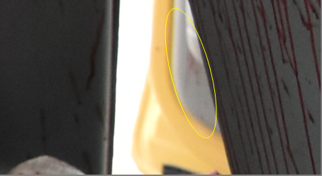 Figure 3: Blood Stains on a Plastic Mask of the Driver’s Door in the Back-Bottom Area.