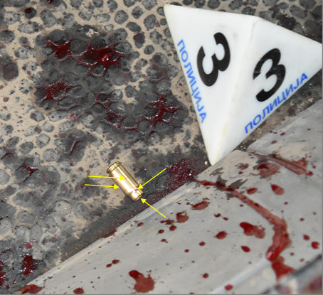 Figure 7: The Bullet Cartridge on the Floor of the Vehicle with a Large Number of Small Spatter Stains.