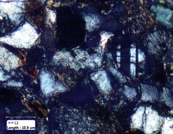Figure 3: Thin section images of sandstone recovered from BH(A) (depth=3827-3837m) showing the presence of diagenetic mica.