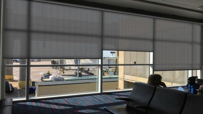 Figure 2: Example of window blinds to reduce daylight glare and sunlight heat gain at an airport boarding gate that reduces the clarity of the exterior window view.