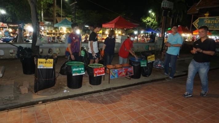 Figure 4: Each station was manned with municipal officers and environmental volunteers including school students during the summer break. The staff informed the visitors how to sort waste. Besides recyclables, food waste was separated for the municipality’s composting program. In addition, plastic straws, spoons, and wooden sticks were diverted from the landfill. These items were later turned into craft products by local villages.
