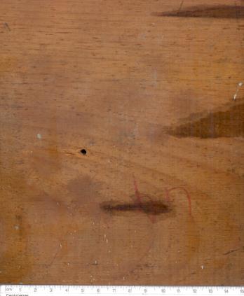 Figure 18: 8mm bullet exit 27.5” on Bakelite hole 27.5” on Bakelite. (Close up view) in shape due to tearing/stretching of the target material. It is most important to properly document the configuration of firearm, when it is fried at crime spot. It is therefore suggested that the hand written notes are especially important because photographs do not always show every details of specific interest.