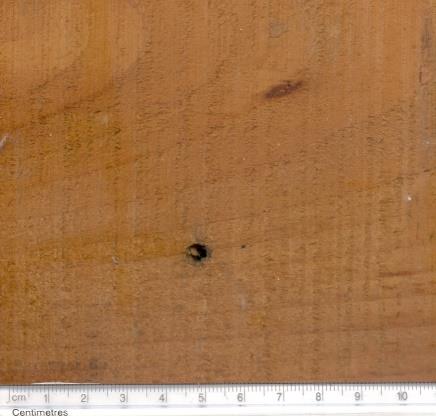 Figure 19: 5.56mm bullet entry hole. Figure 20: 5.56mm bullet exit hole on2’Glass sheet on 2’ glass sheet.