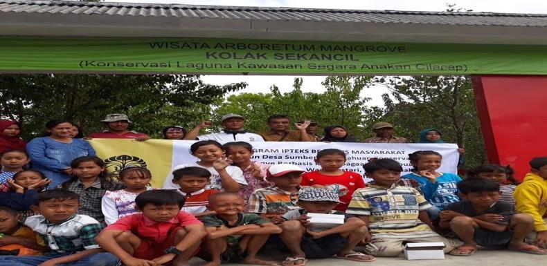 Figure 1: Children of Kampung Laut Community in front of the gateway to mangrove trekking tourism: They Role as Subjects in the Development of Local Tourism Activities.