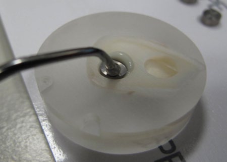 Figure 2: Stainless steel rod pushed to the side to form a half moon.